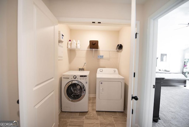 washroom with ceiling fan, light colored carpet, and independent washer and dryer