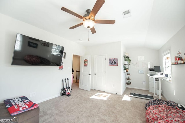 interior space featuring light colored carpet, ceiling fan, and lofted ceiling