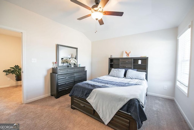 carpeted bedroom with ceiling fan and lofted ceiling