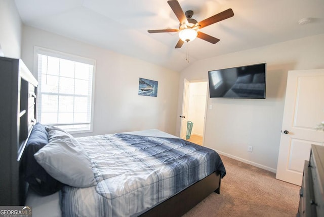 bedroom with light carpet, ceiling fan, and lofted ceiling