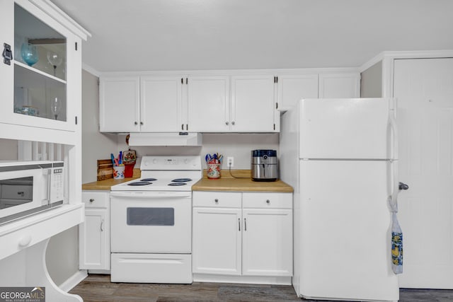 kitchen featuring white appliances, white cabinetry, and dark wood-type flooring