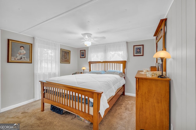 bedroom with light carpet and ceiling fan