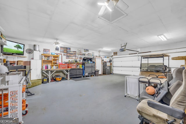 garage featuring a garage door opener and ceiling fan