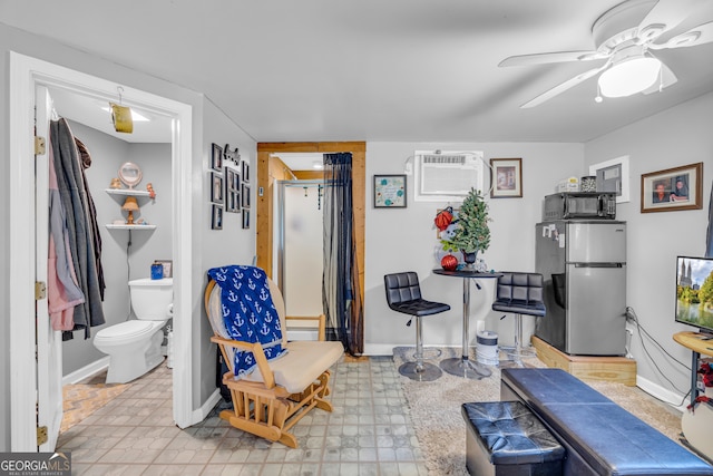 interior space with a wall mounted air conditioner and ceiling fan