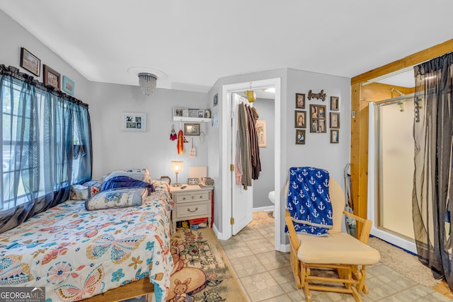 bedroom with a walk in closet and a closet