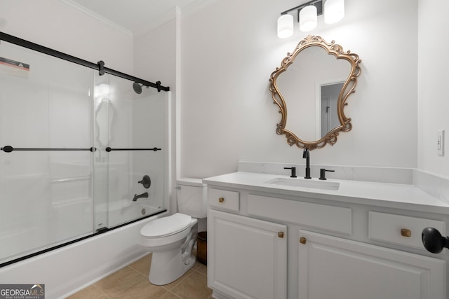 full bathroom featuring tile patterned floors, bath / shower combo with glass door, toilet, vanity, and ornamental molding