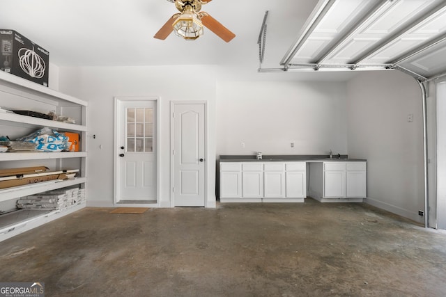 garage with ceiling fan and sink