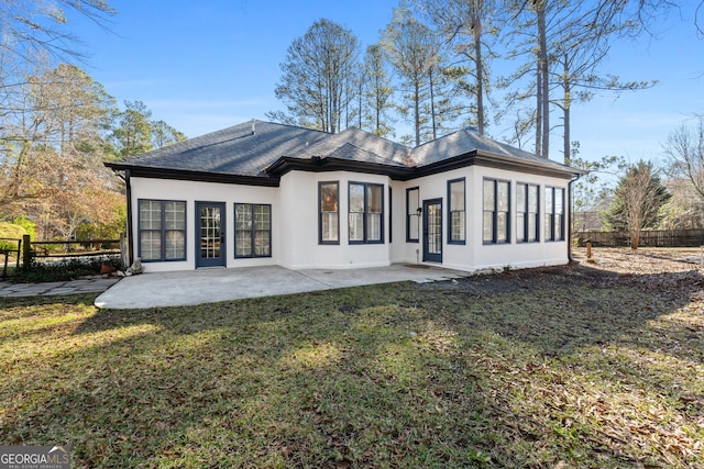 back of house featuring a yard and a patio