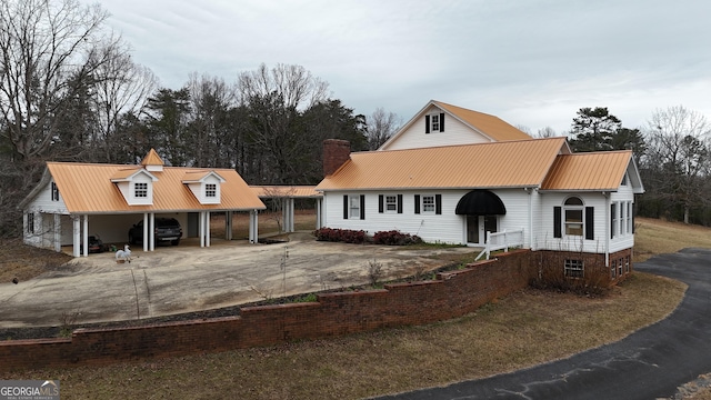 view of front of property with a carport