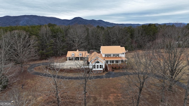 birds eye view of property featuring a mountain view