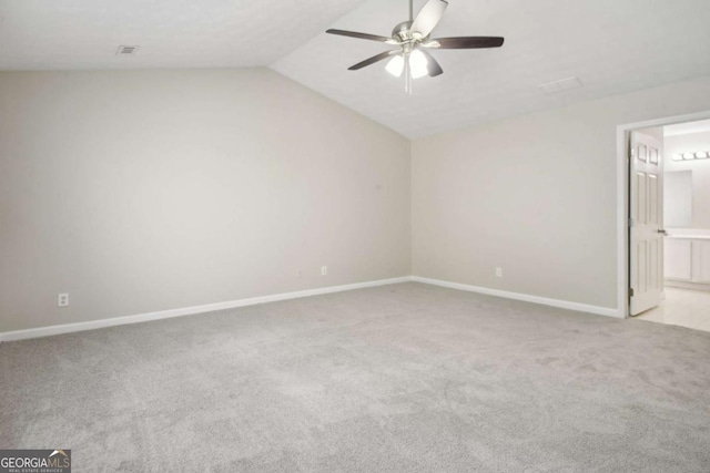 unfurnished room with light colored carpet, ceiling fan, and lofted ceiling