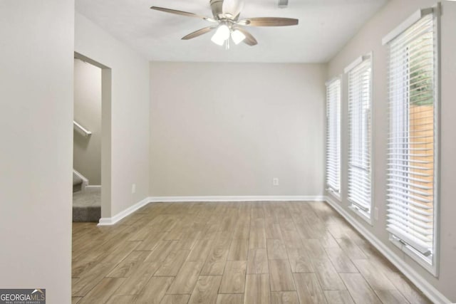 unfurnished room featuring ceiling fan and light hardwood / wood-style floors