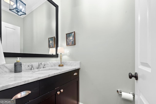 bathroom featuring vanity and ornamental molding