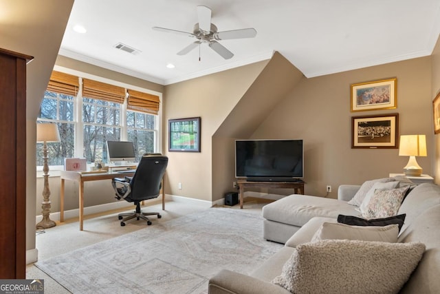 home office with visible vents, a ceiling fan, carpet floors, crown molding, and baseboards