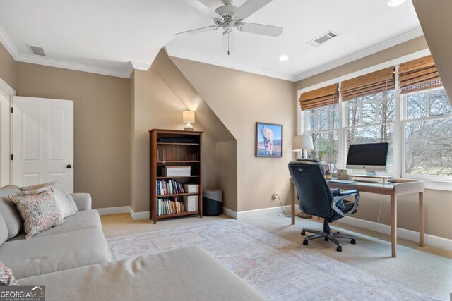 carpeted home office featuring baseboards, visible vents, and crown molding