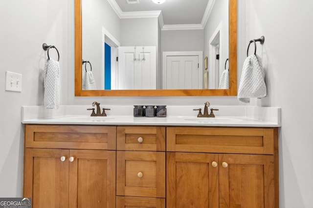 bathroom featuring crown molding and vanity