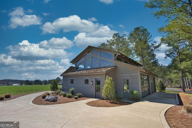 view of side of property featuring driveway