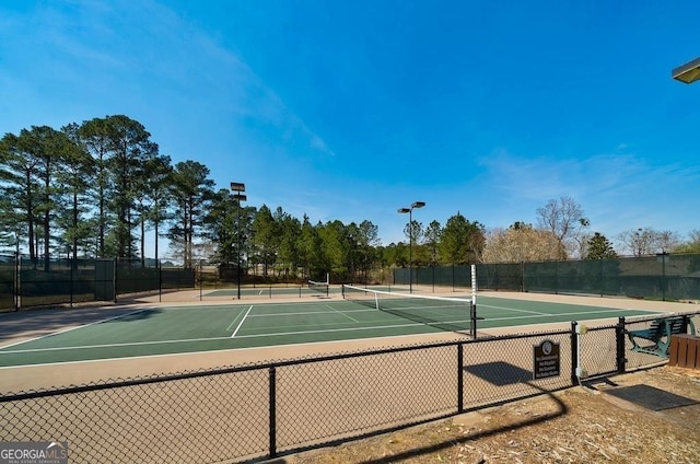 view of sport court featuring community basketball court and fence