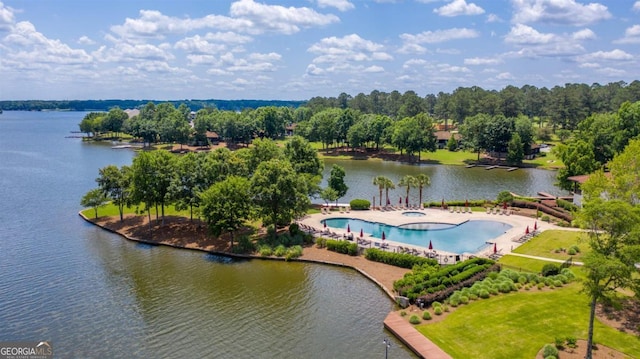 birds eye view of property with a water view