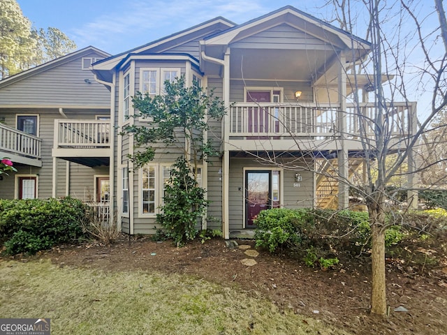 rear view of house featuring a balcony