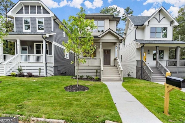 view of front of home with covered porch and a front lawn