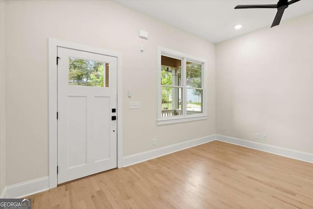 entrance foyer featuring ceiling fan and light wood-type flooring