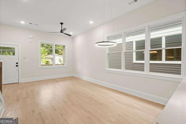 interior space featuring ceiling fan and light hardwood / wood-style flooring