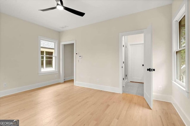 spare room with ceiling fan and light hardwood / wood-style floors