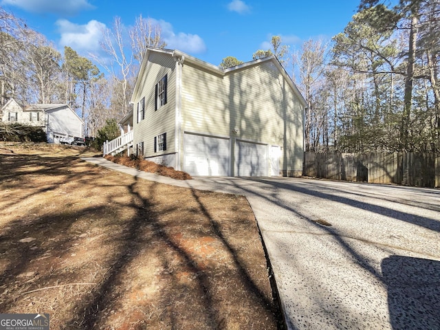 view of property exterior featuring a garage