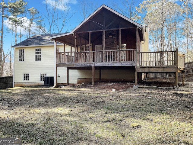 rear view of property featuring cooling unit and a deck