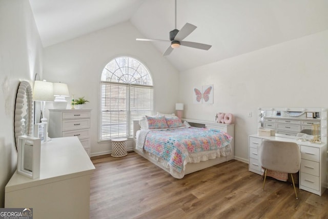 bedroom featuring ceiling fan, hardwood / wood-style floors, and vaulted ceiling