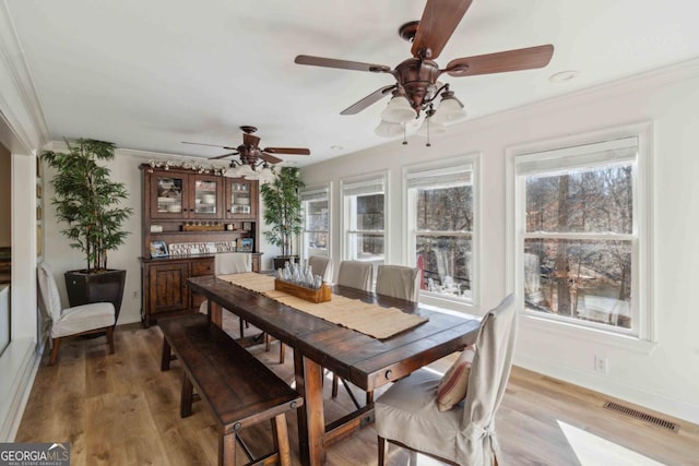 bedroom featuring ceiling fan, hardwood / wood-style floors, and vaulted ceiling