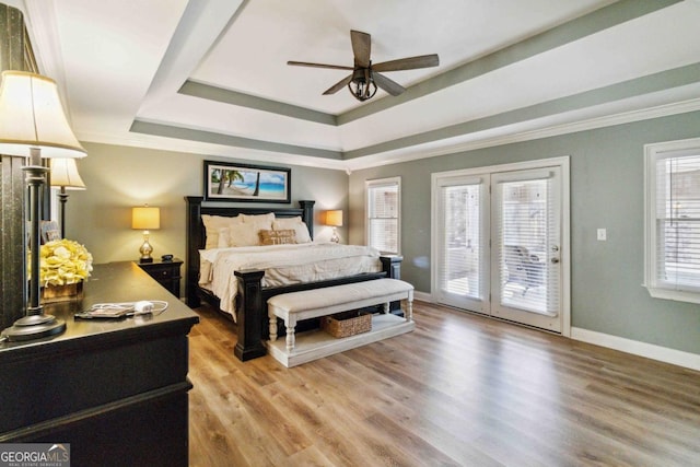 sunroom featuring ceiling fan, a wealth of natural light, and a water view