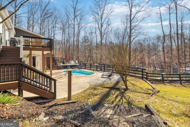 view of pool featuring a deck and a patio