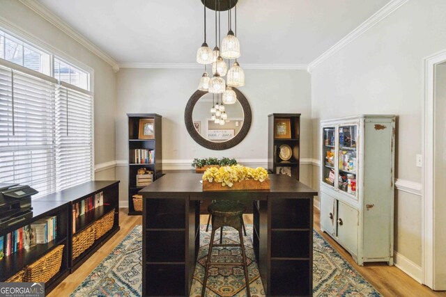 exercise room with ceiling fan, hardwood / wood-style floors, and ornamental molding