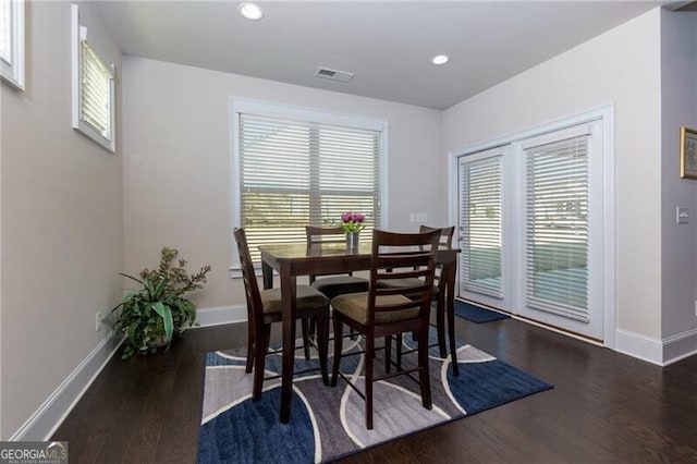 dining room with dark wood-type flooring