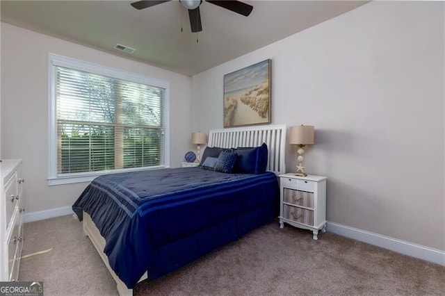 bedroom featuring ceiling fan and light carpet