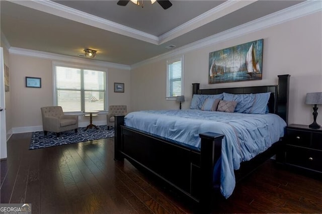 bedroom with multiple windows, ceiling fan, dark hardwood / wood-style flooring, and ornamental molding