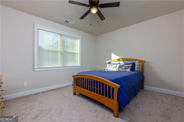 carpeted bedroom featuring ceiling fan