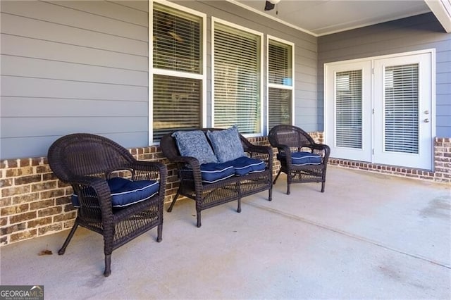 view of patio with an outdoor living space and french doors