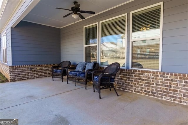 view of patio with ceiling fan and an outdoor living space