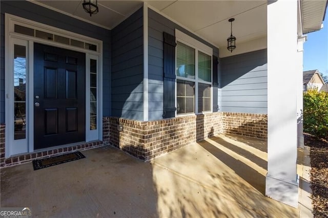 entrance to property featuring a porch