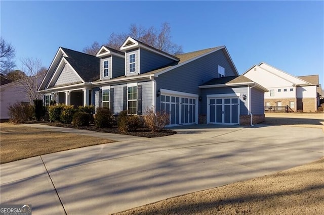 view of side of home featuring a garage