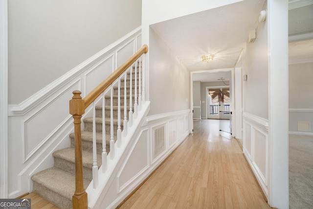 stairs featuring hardwood / wood-style floors