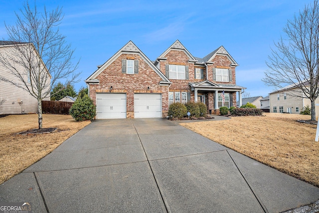 view of front of home with a front yard and a garage