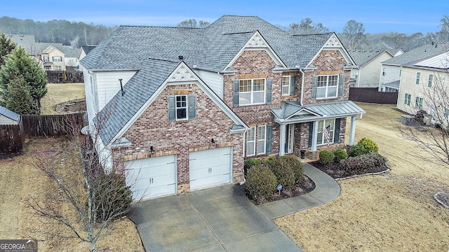 view of front of property featuring a garage and a front yard