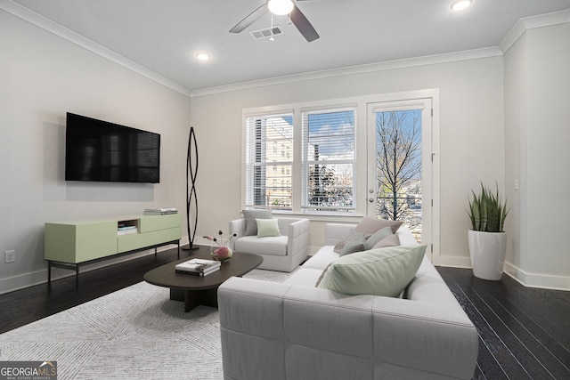 living room featuring ceiling fan, dark hardwood / wood-style floors, and ornamental molding