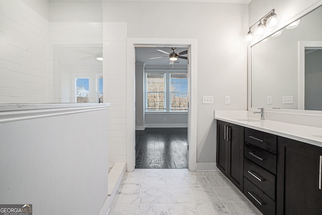 bathroom featuring vanity, ceiling fan, and tiled shower