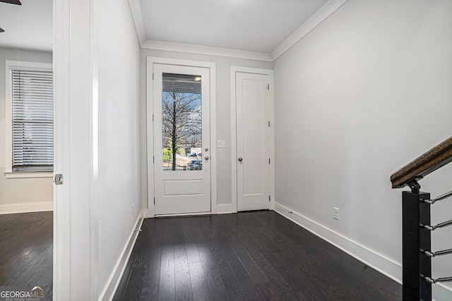 entryway with dark hardwood / wood-style floors and crown molding