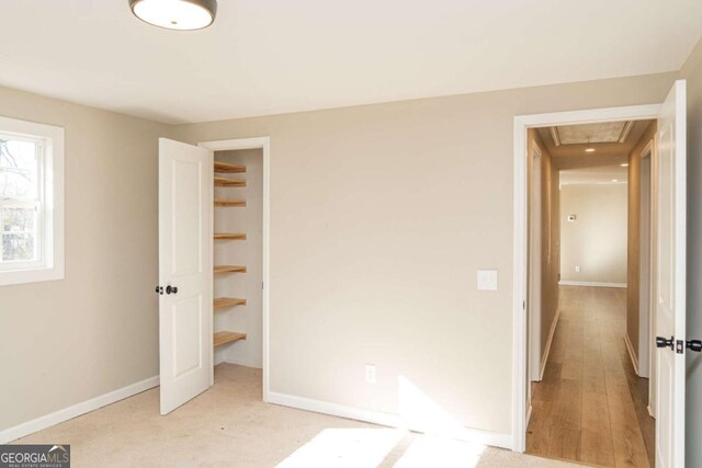 unfurnished bedroom with light carpet